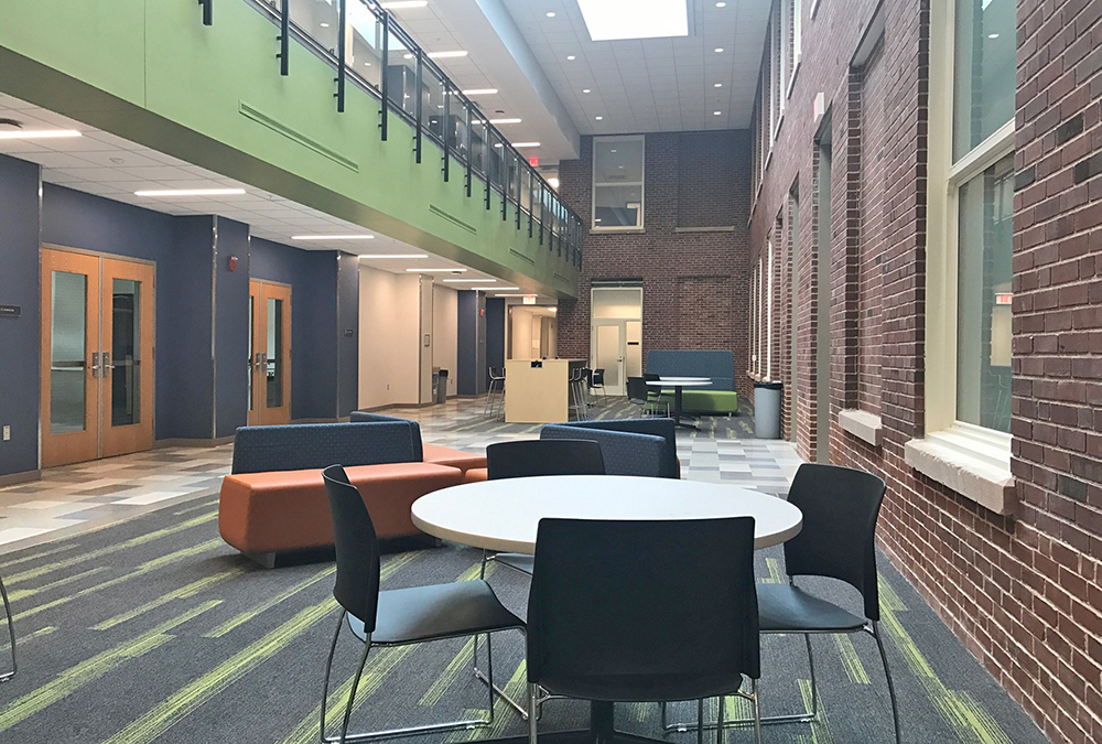 window-lit atrium with seating and tables